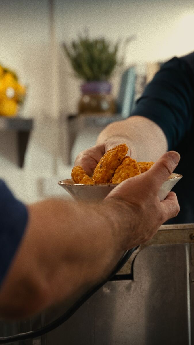 Close-up — goujons being served from the fryer