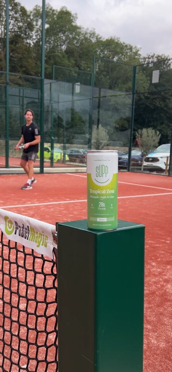 SUPP Tropical Zest can on the padel court net post
