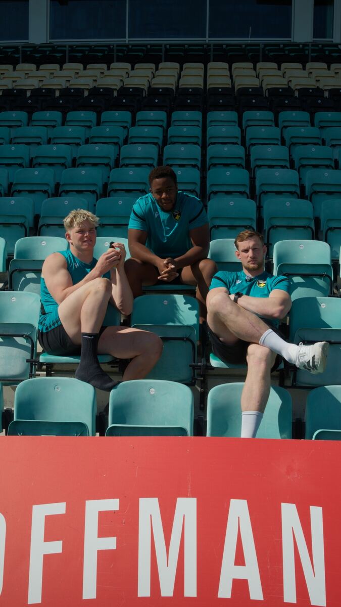 Saints players relaxing in the stadium seats