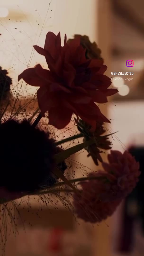 She Selected 5 year event — floral installation with red dahlias